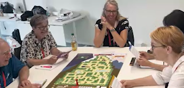 Players around a board game